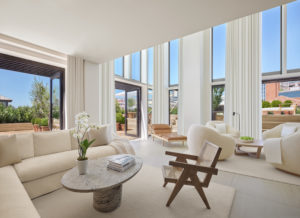 Two-story penthouse living room with open terrace