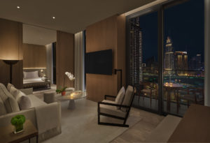 Suite living room with nighttime city view