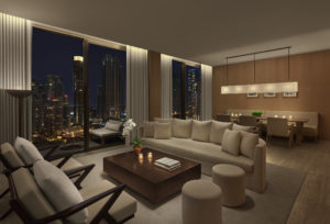 Suite living room with nighttime city view