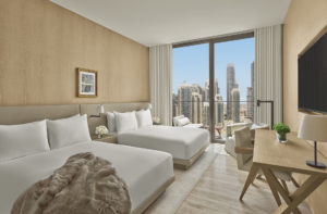 Guest room with two beds and city view