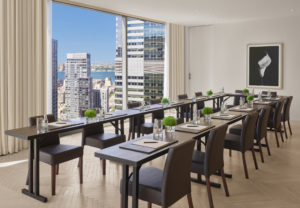 Meeting room with U-shaped table and city view